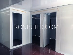 3 doors of the interior of the shipping container home under construction.